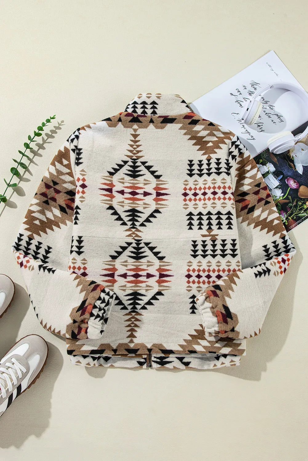 Southwestern quilted zip-up jacket in eggshell with geometric pattern, long sleeves, and collar.