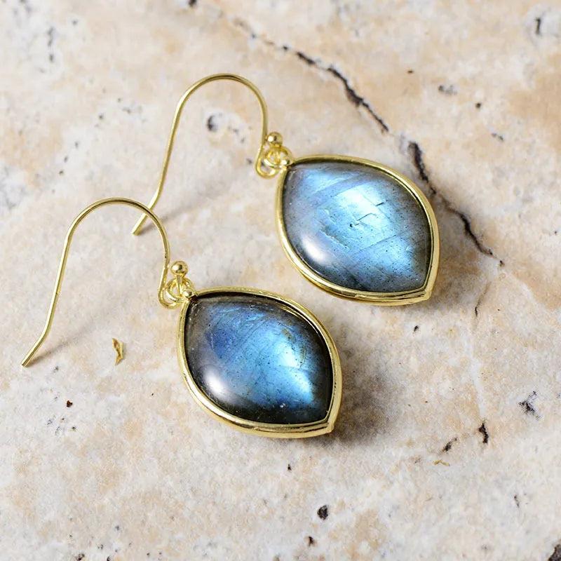 Cosmic Quartz Droplet Earrings with blue iridescent stones and gold setting.