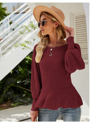 Burgundy ribbed knit peplum top with balloon sleeves and a boat neckline.