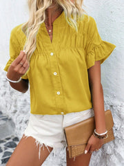 Yellow button-up blouse with gathered yoke and ruffle sleeves.