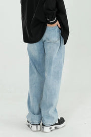 Relaxed fit light wash denim jeans with wide legs and a casual style.