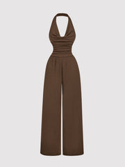 Brown halter neck wide-leg romper with ruched bodice and elastic waist