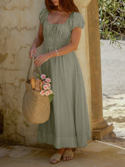 Sage green smocked waist maxi dress with puff sleeves and square neckline, a-line cut