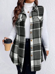 Oversized plaid shirt vest in black and white with button front and chest pockets.