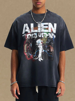 Black oversized tee with a distressed alien graphic print and crew neck.