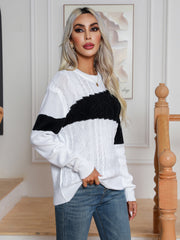 Colorblock cable knit crewneck sweater in white with black stripe detail.