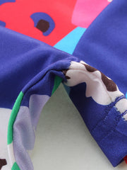 Toddler A-line dress with a colorful floral print and blue fabric detail.