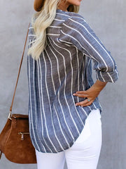 Dusty blue striped buttoned blouse with V-neck and rolled sleeves.