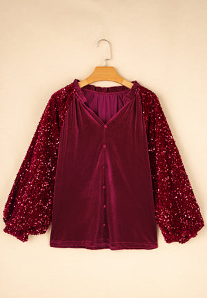 Red velvet blouse with sequin sleeves and button front.