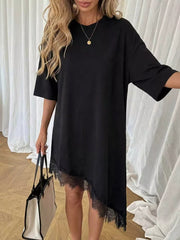 Black asymmetrical t-shirt dress with lace trim hem and short sleeves.
