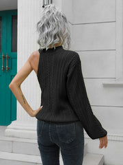 Black asymmetric cable knit sweater with one shoulder cutout and mock neck