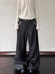 Men's black wide leg sweatpants with decorative buttons and a belt.