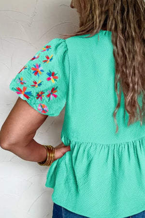 Textured floral embroidery puff sleeve blouse with tiered hem