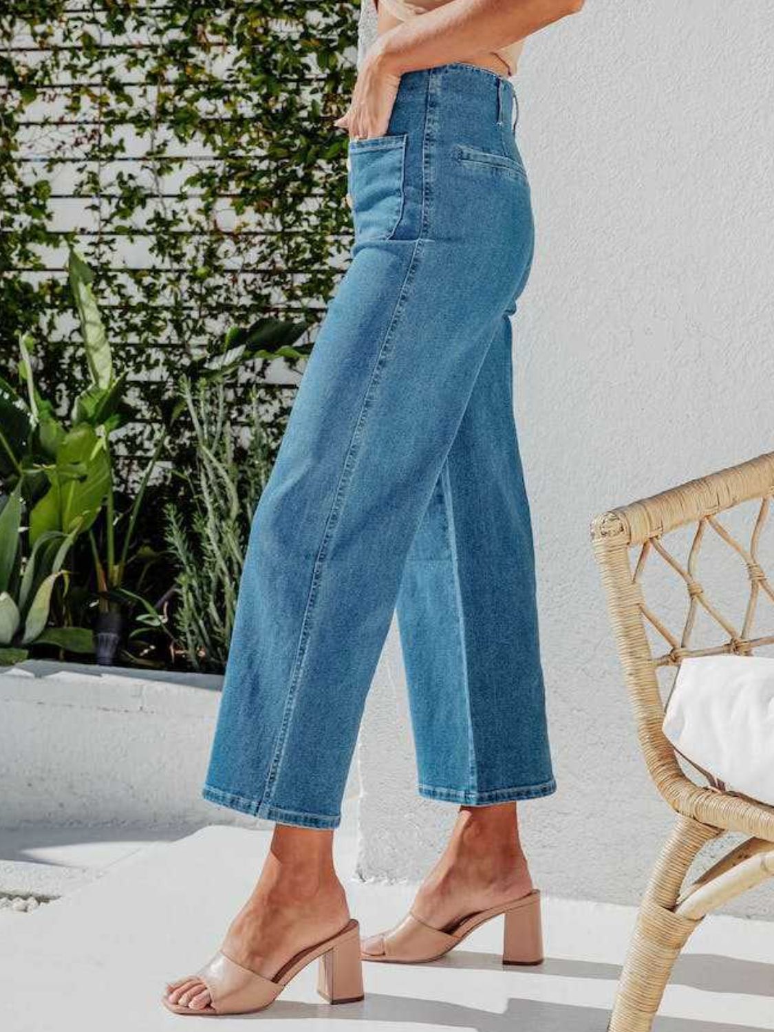 Button-front wide-leg cropped jeans in light blue denim, cropped length, casual style.