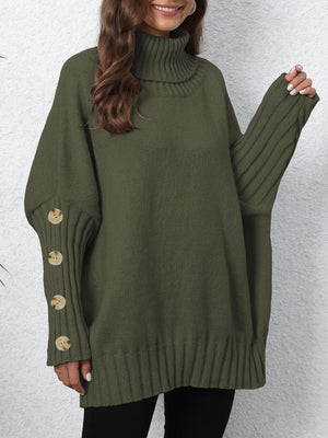 Button-cuff turtleneck sweater in olive green knit with ribbed sleeves and button detail.