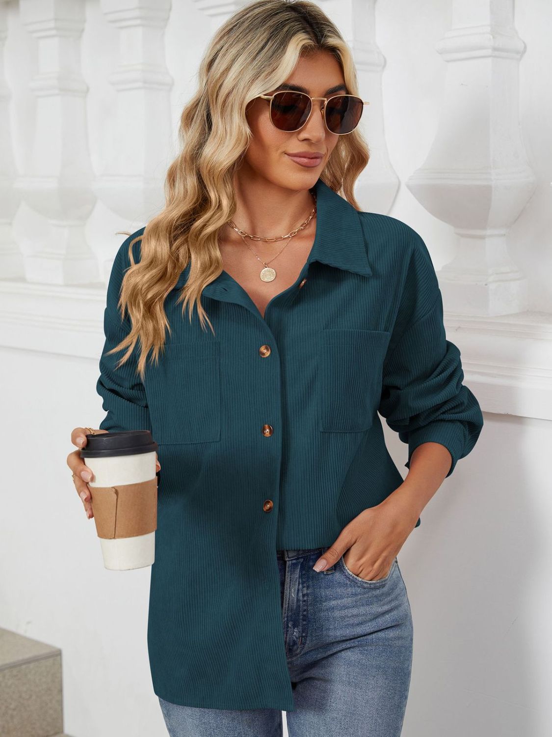 Dark Navy corduroy overshirt with patch pockets and button front, worn by a woman holding a coffee cup.