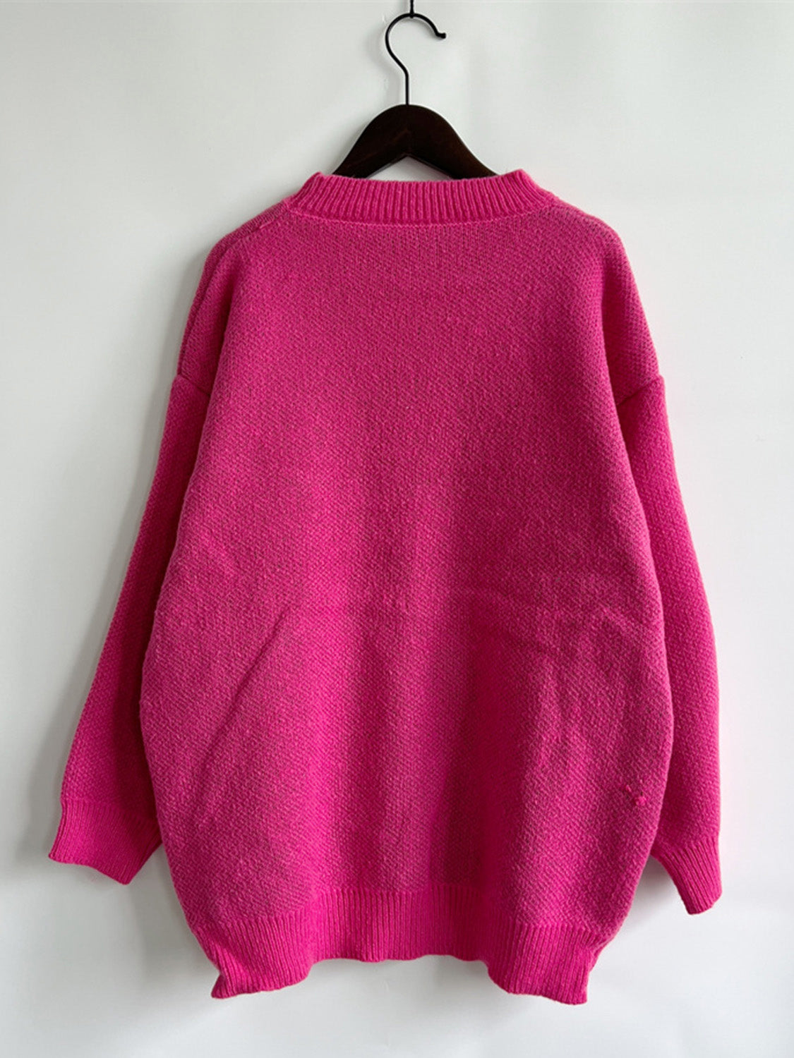 Pink knit jumper with mock neck and ribbed cuffs and hem