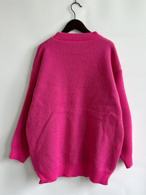 Pink knit jumper with mock neck and ribbed cuffs and hem
