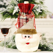 Holiday wine bottle cover with Santa face and plaid fabric top.