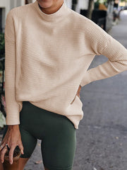Sand ribbed turtleneck sweater with long sleeves and a relaxed fit.