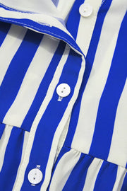 Blue and white striped button-down shirt with ruffled hem detail and white buttons.