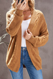 Camel cable knit open-front cocoon cardigan with textured sleeves.