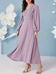 Lavender ruched maxi dress with decorative buttons and balloon sleeves.