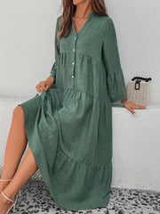 Green tiered ruffle hem v-neck dress with button front and bell sleeves.