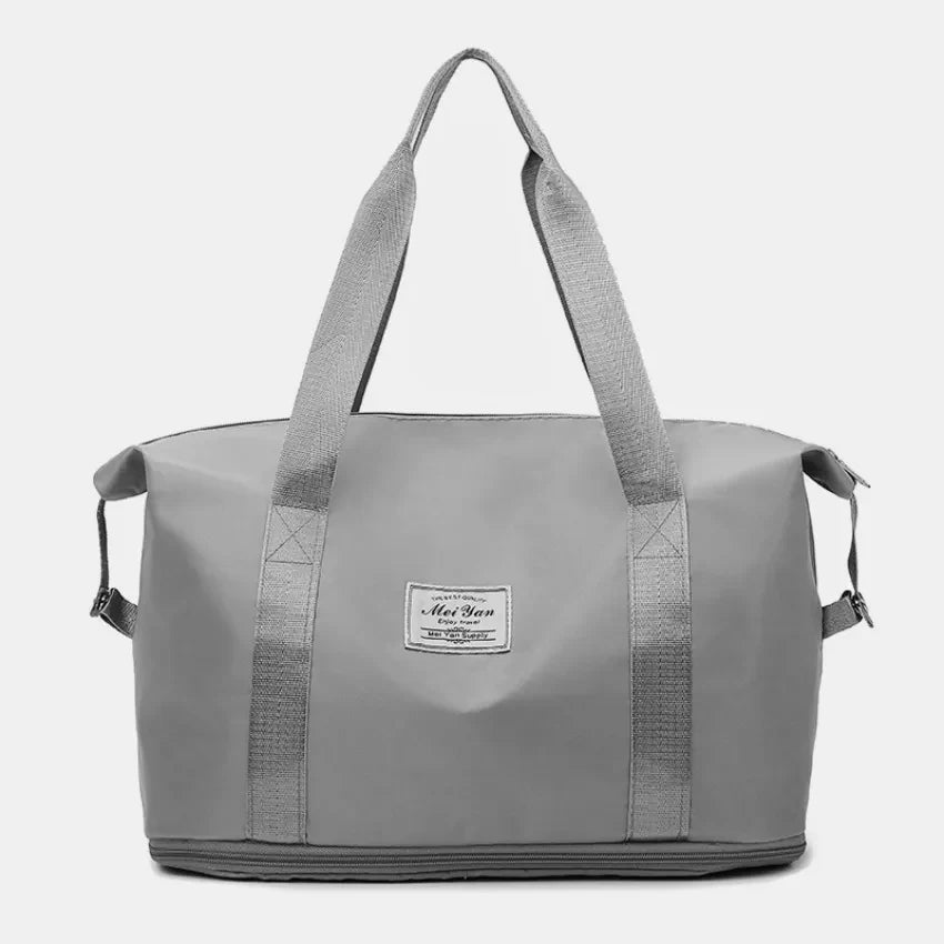 Gray nylon shopper bag with dual handles and a central label.