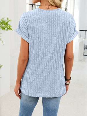 Light blue ribbed knit v-neck t-shirt with cuffed short sleeves and button detail.