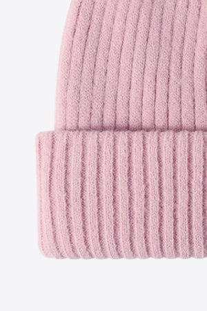 Pink ribbed acrylic beanie with a cuffed hem