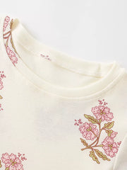 Charming floral cotton dress for toddlers in beige, featuring pink floral print and crew neck.