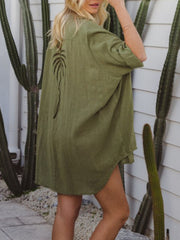 Green cotton blend button-down shirt dress with palm tree embroidery detail.