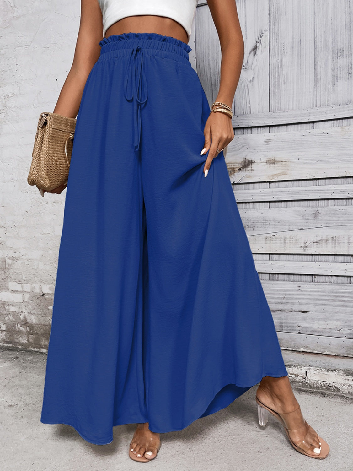Royal blue palazzo trousers with ruffled waistline and drawstring, wide leg, casual flowy fit.