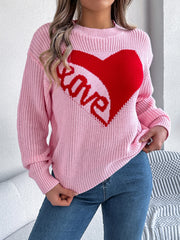 Blush pink knit sweater with red heart graphic and "love" text, crew neck, long sleeves.
