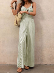 Light green striped cotton jumpsuit with twist-front cutout and wide legs.