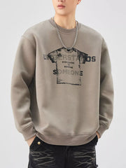 Men's oversized khaki graphic sweatshirt with crewneck and text print.