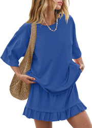 Relaxed fit sapphire blue tee and ruffled skirt set with a woven bag.