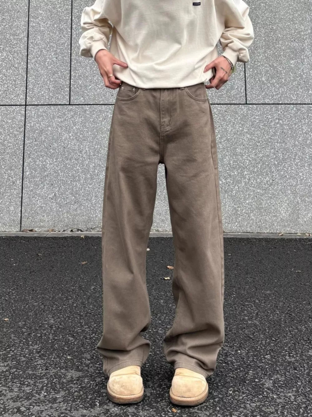 Men's brown wide-leg sweatpants with a relaxed fit and drawstring waist.