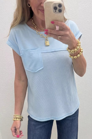 Light blue waffle knit t-shirt with chest pocket and curved hem