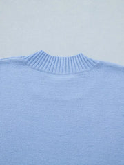 Light blue ribbed knit top with ruffled round neck detail