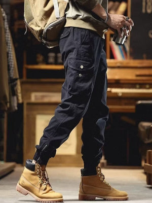 Men's black cargo joggers with drawstring and zippered ankles.