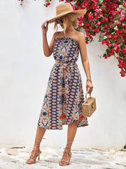 Printed bandeau midi dress with asymmetric hem and belt in dark blue.