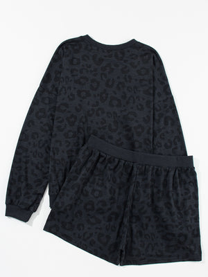 Dark gray leopard print pajama set with crew neck sweatshirt and elastic waist shorts.