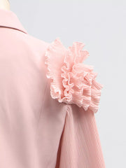 Pink skirt suit with elegant frill collar and pleated balloon sleeves.