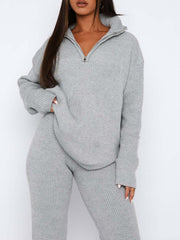 Gray ribbed knit quarter-zip lounge set with a relaxed fit and high collar.