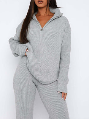 Gray ribbed knit quarter-zip lounge set with a relaxed fit and high collar.