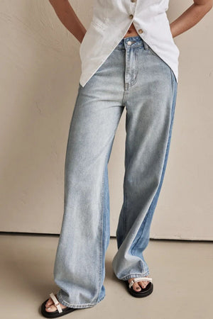 Panelled wide-leg denim trousers in light wash with contrast panels and a relaxed fit.