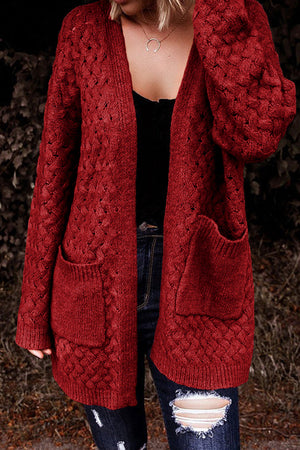 Deep Red open-knit pocket cardigan with textured acrylic knit and long sleeves.