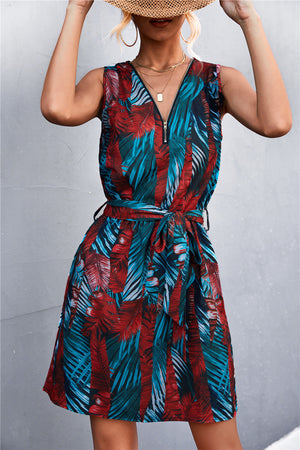 Floral zip-front mini dress with tie waist in black/red and teal.